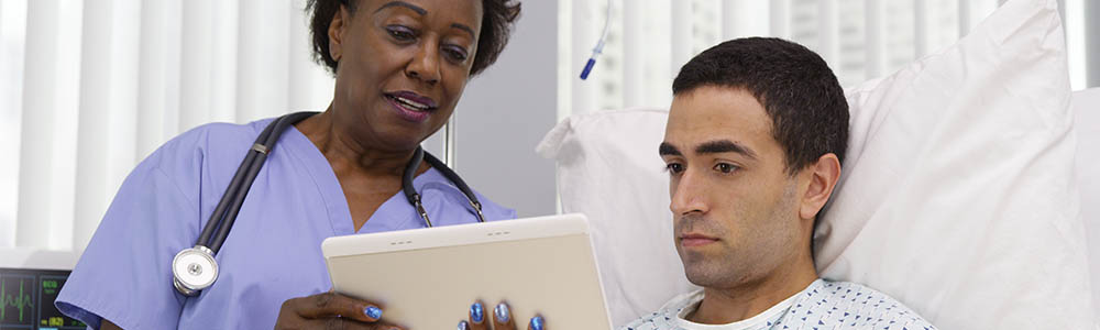 Nurse showing patient something on a tablet